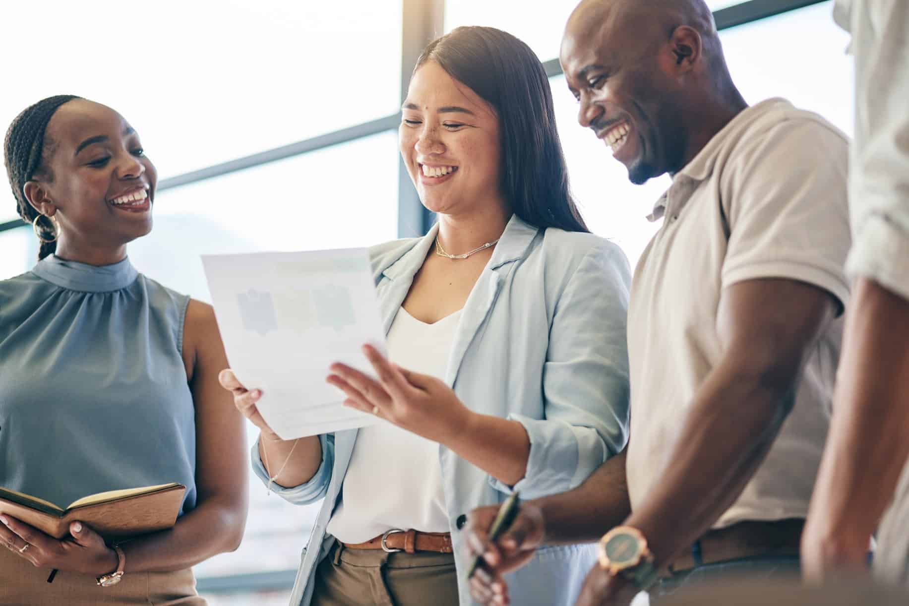 Group of happy employees who feel psychologically safe at work