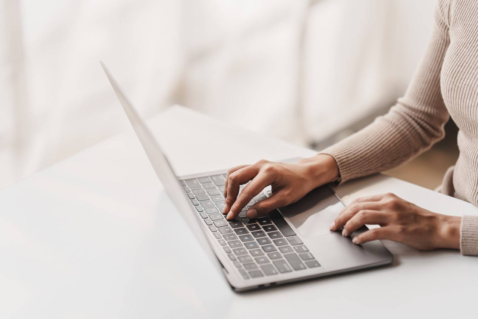 Woman applying to jobs on laptop