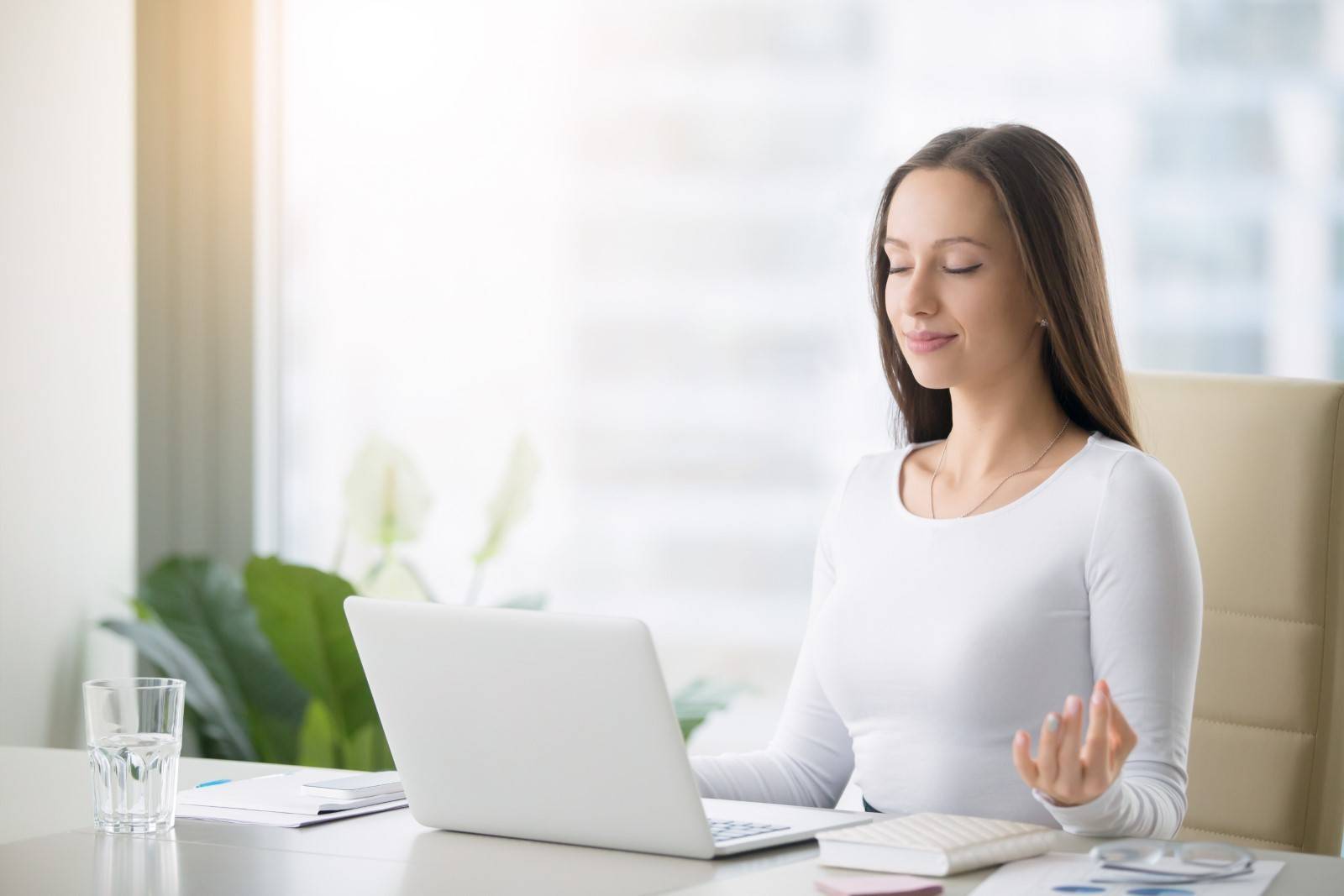 Woman meditating at desk