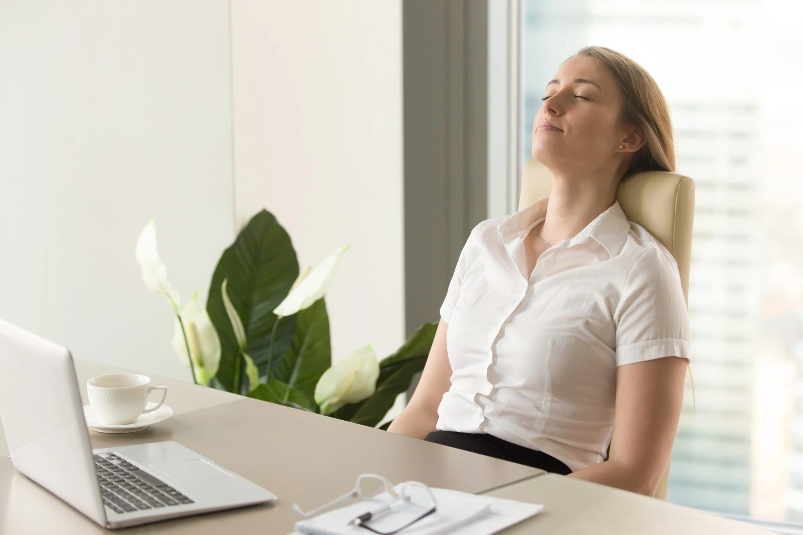 Businesswoman with eyes closed