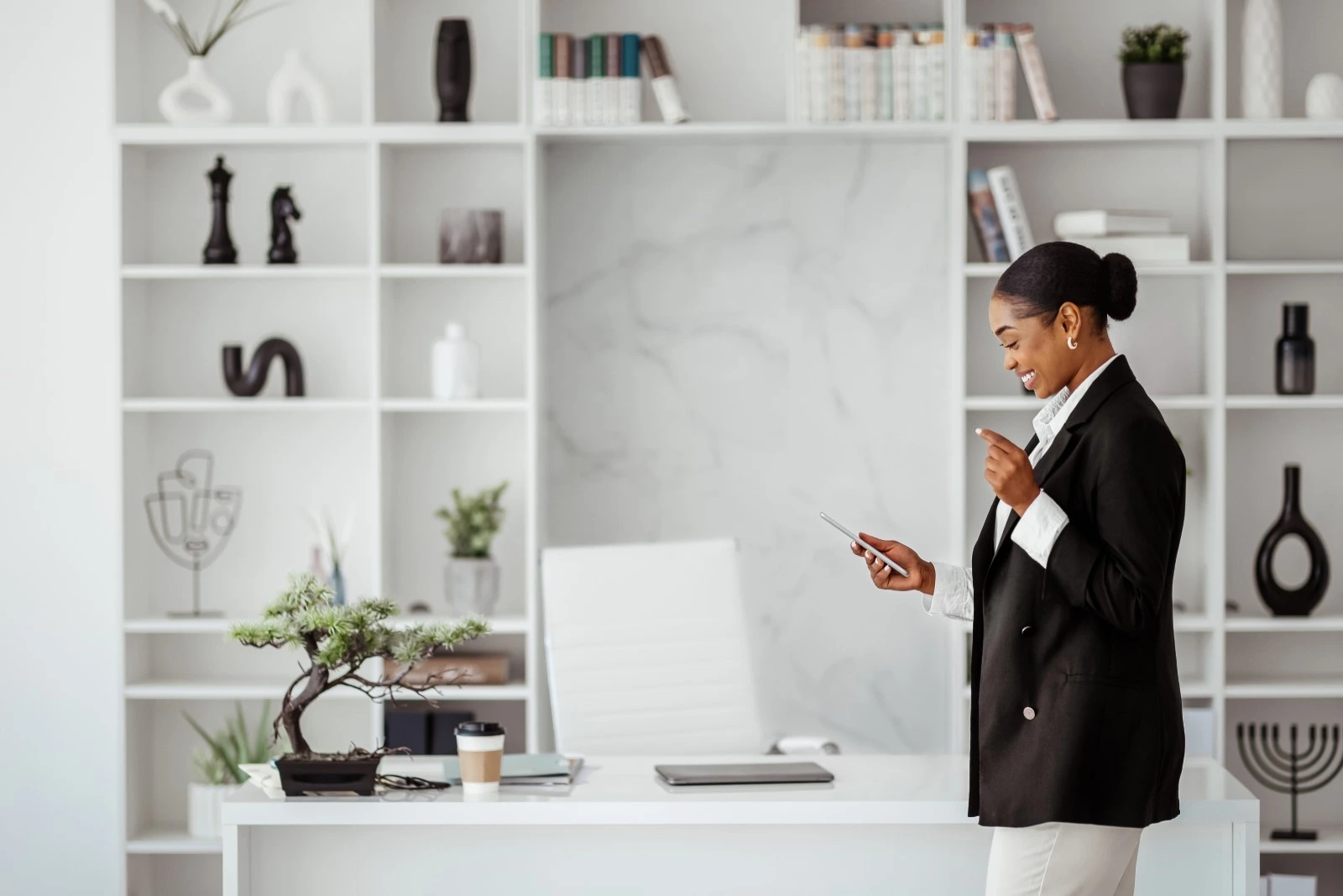 Businesswoman walking around while on phone